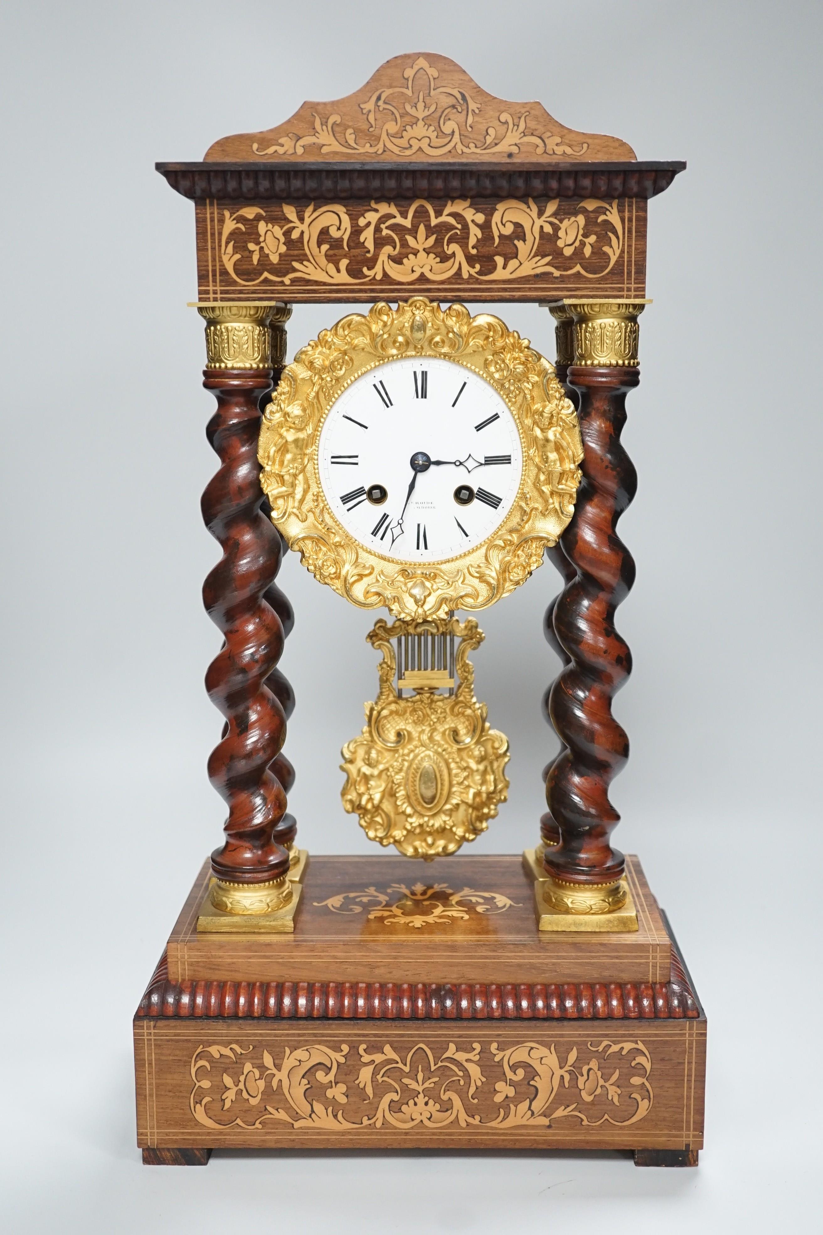 A 19th century Napoleon III rosewood inlaid and ormolu mounted portico clock, 47cms high